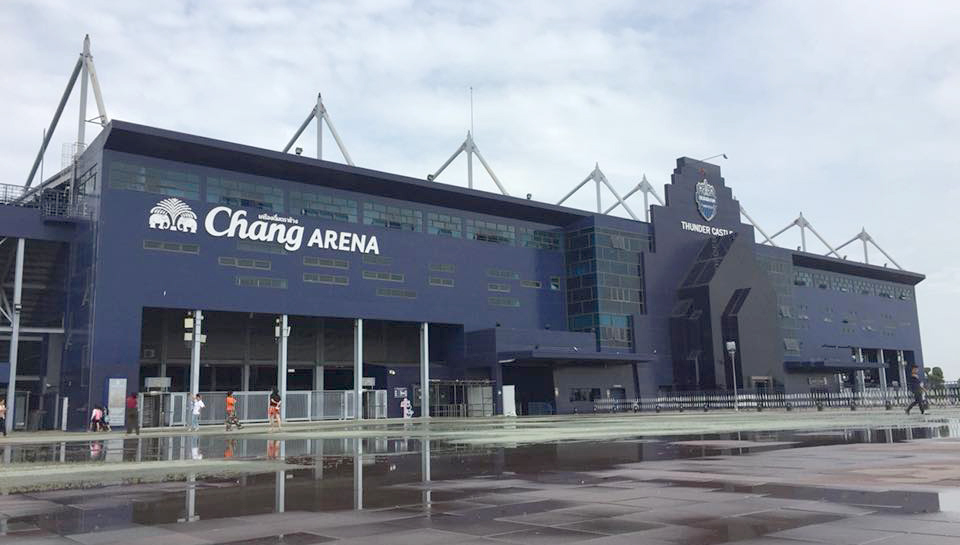 The exterior of Chang Arena in Buriram with its dark-blue cladding and steel roof supports