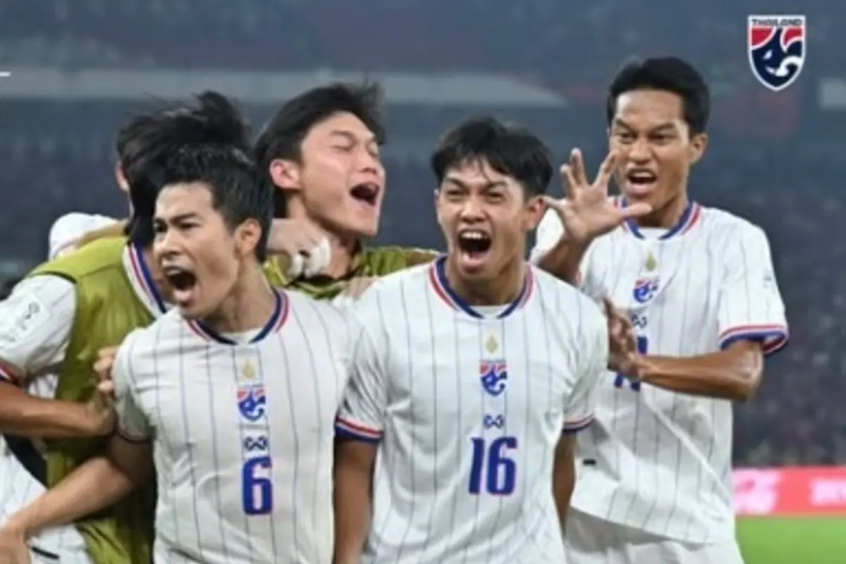 Iklas Sanron, wearing 16, celebrates with Thailand team-mates
